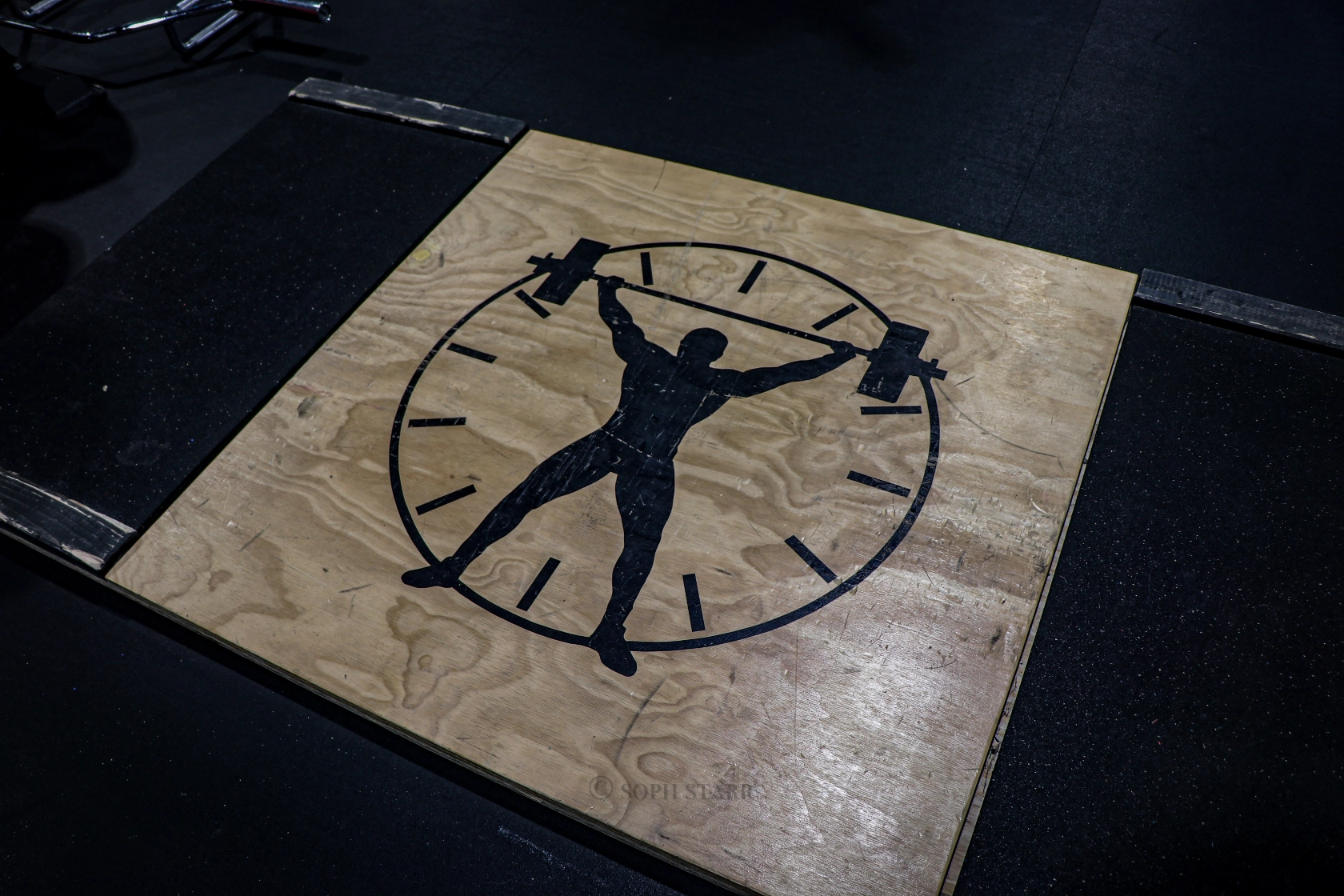 Deadlift platform with the 24 Seven Club Fitness logo